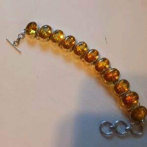 Ladies silver bracelet with green stones